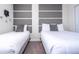 Bedroom with twin beds and gray headboard wall at 4845 Romeo Cir, Kissimmee, FL 34746