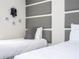 Bedroom with twin beds and gray headboard wall at 4845 Romeo Cir, Kissimmee, FL 34746
