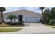 Single-story home with attached garage and landscaping at 12254 Sandy Apple Rd, Orlando, FL 32824