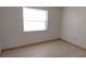 Simple bedroom with tile floors and a large window at 35 N Lakeshore Dr, Lake Wales, FL 33859