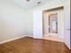 Bedroom with wood-look flooring and neutral walls, ready for personalization at 513 Viterra Ct, Kissimmee, FL 34759