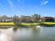 Charming home with a terracotta roof, overlooking a sparkling pond at 513 Viterra Ct, Kissimmee, FL 34759
