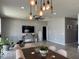 Combined dining and living room with decorative lighting and modern furniture at 12254 Sandy Apple Rd, Orlando, FL 32824