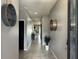 Bright and spacious entryway with tile flooring and modern wall decor at 12254 Sandy Apple Rd, Orlando, FL 32824