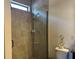 Large walk in shower with glass enclosure and neutral tile at 12254 Sandy Apple Rd, Orlando, FL 32824