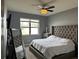 Spacious main bedroom with large bed, window, and mirror at 12254 Sandy Apple Rd, Orlando, FL 32824