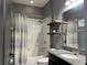 Modern bathroom with granite countertop and tub shower combo at 12254 Sandy Apple Rd, Orlando, FL 32824