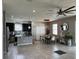 Modern kitchen with dark cabinets, granite countertops, and stainless steel appliances at 12254 Sandy Apple Rd, Orlando, FL 32824