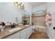 Bathroom with double vanity, granite countertop, and a bathtub at 1542 Sun Meadow Dr, Orlando, FL 32824