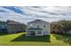 Two-story house with a covered patio and large backyard at 1542 Sun Meadow Dr, Orlando, FL 32824
