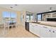 Eat-in kitchen with lake view, granite counters & breakfast nook at 1542 Sun Meadow Dr, Orlando, FL 32824