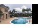 Community pool with lounge chairs at 1542 Sun Meadow Dr, Orlando, FL 32824