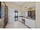 Main bathroom with double vanity, granite countertop, and a walk-in shower at 1542 Sun Meadow Dr, Orlando, FL 32824