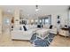 Living room with a large sectional sofa, a white coffee table, and blue accents at 1542 Sun Meadow Dr, Orlando, FL 32824