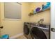 Bright laundry room with modern washer and dryer at 1542 Sun Meadow Dr, Orlando, FL 32824