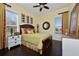 Guest bedroom with dark wood floors and a ceiling fan at 1542 Sun Meadow Dr, Orlando, FL 32824