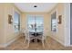 Bright breakfast nook with lake view and seating for four at 1542 Sun Meadow Dr, Orlando, FL 32824