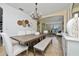 Open dining room with a wooden table, bench seating, and chandelier at 1542 Sun Meadow Dr, Orlando, FL 32824
