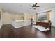 Upstairs hallway with hardwood floors and access to bedrooms at 1542 Sun Meadow Dr, Orlando, FL 32824