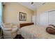 Bedroom with wood sleigh bed, and sitting chair at 1542 Sun Meadow Dr, Orlando, FL 32824
