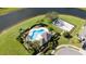 Aerial view of community pool, playground, and sand volleyball at 1542 Sun Meadow Dr, Orlando, FL 32824