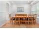 Dining room with wood table and green chairs at 7524 Gathering Dr, Reunion, FL 34747