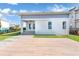 Modern home with large backyard, patio, and artificial turf at 13010 Stoddart Ave, Orlando, FL 32827