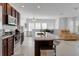 Modern kitchen with stainless steel appliances and an island at 13010 Stoddart Ave, Orlando, FL 32827
