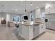 Modern kitchen with large island and stainless steel appliances at 13010 Stoddart Ave, Orlando, FL 32827