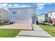 Modern backyard with wood deck and artificial turf at 13010 Stoddart Ave, Orlando, FL 32827