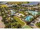 Aerial view of community amenities including pools, a lake, and a clubhouse at 13010 Stoddart Ave, Orlando, FL 32827