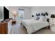Main bedroom with large bed, TV, and ample closet space at 13010 Stoddart Ave, Orlando, FL 32827