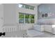 ' bedroom with twin beds, daybed, and ample light at 13010 Stoddart Ave, Orlando, FL 32827