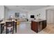 Open concept kitchen with an island, granite countertops, and stainless steel appliances at 13010 Stoddart Ave, Orlando, FL 32827