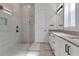 Elegant bathroom with double vanity and large walk-in shower at 13010 Stoddart Ave, Orlando, FL 32827