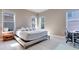 Bright bedroom with a king-size bed and built-in workspace at 13010 Stoddart Ave, Orlando, FL 32827
