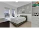 Cozy bedroom with a comfortable bed, ample storage, and charming wall decor at 13010 Stoddart Ave, Orlando, FL 32827