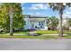 A charming single story home with a welcoming front porch and landscaping at 13010 Stoddart Ave, Orlando, FL 32827