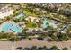 Aerial view of community pool area, showing various pools and lounge areas at 13010 Stoddart Ave, Orlando, FL 32827