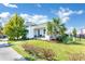 Modern house exterior showcasing a landscaped lawn and walkway at 13010 Stoddart Ave, Orlando, FL 32827