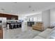 Modern kitchen with island, stainless steel appliances, and an open floor plan at 13010 Stoddart Ave, Orlando, FL 32827
