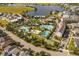Aerial view of community amenities including pools, a lake, and a clubhouse at 13010 Stoddart Ave, Orlando, FL 32827