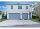 Two-car garage and nicely landscaped front yard at 13010 Stoddart Ave, Orlando, FL 32827