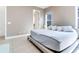 Spacious bedroom with king-size bed and access to en-suite bathroom at 13010 Stoddart Ave, Orlando, FL 32827