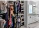 Organized walk-in closet with shelving, drawers, and hanging space at 13010 Stoddart Ave, Orlando, FL 32827