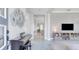 Spacious entryway with piano, view into living area at 13010 Stoddart Ave, Orlando, FL 32827