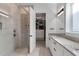 Bathroom boasts a shower, granite countertops, and access to a walk-in closet at 13010 Stoddart Ave, Orlando, FL 32827