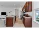 Modern kitchen with granite countertops, stainless steel appliances, and an island at 13010 Stoddart Ave, Orlando, FL 32827