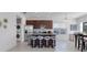 Modern kitchen with stainless steel appliances and breakfast bar at 13010 Stoddart Ave, Orlando, FL 32827