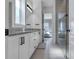 Double vanity bathroom with granite countertop and a walk-in shower at 13010 Stoddart Ave, Orlando, FL 32827